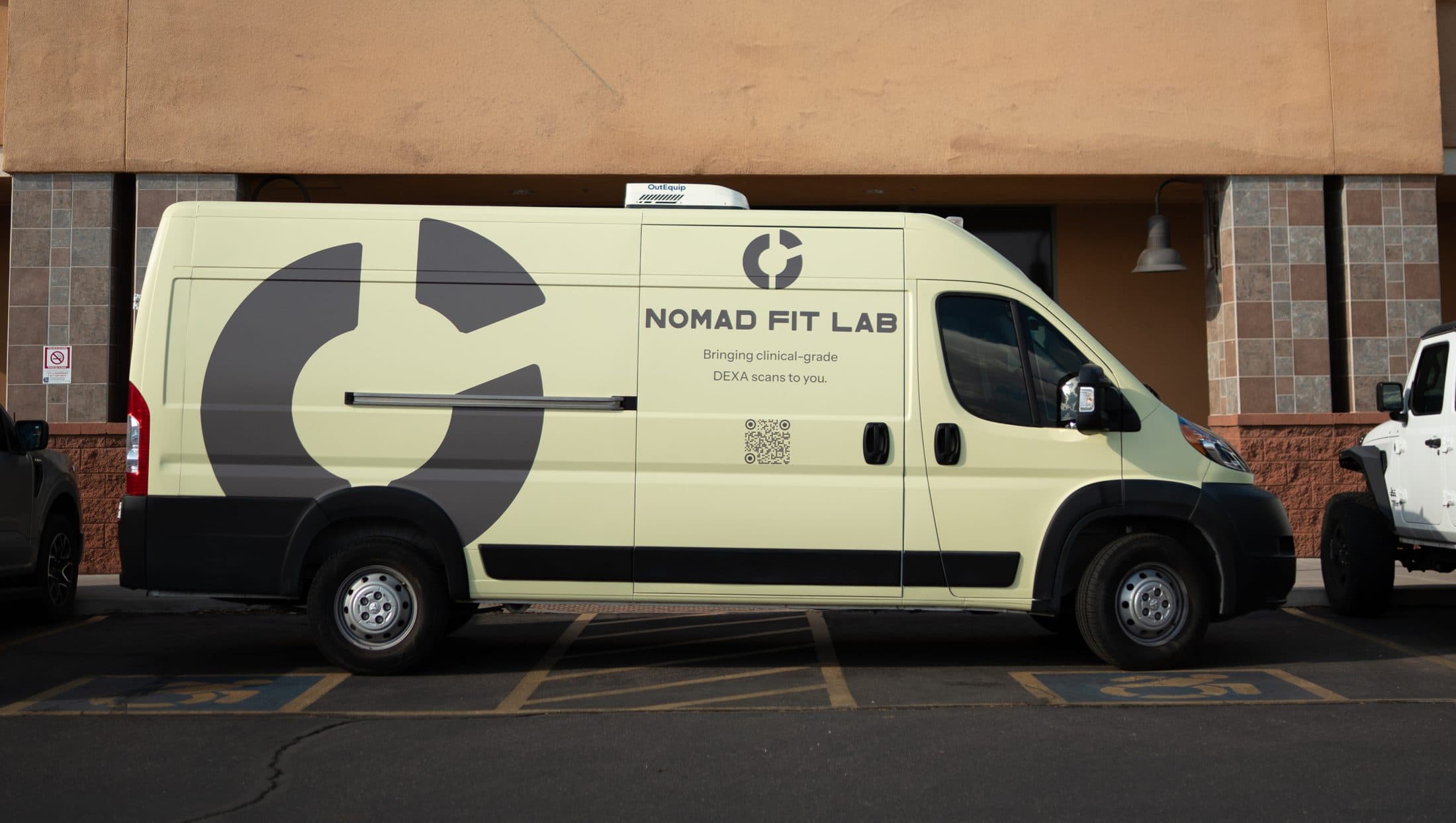 The Nomad Fit Lab van parked outside a gym